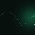 A green radar screen with a missile trajectory arc on a dark background