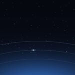 Satellites orbiting above the curve of the Earth at night